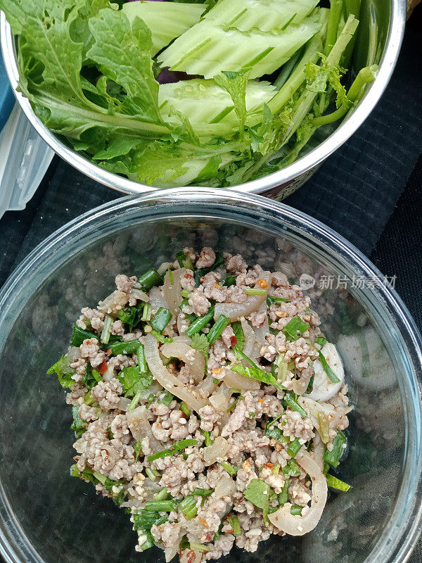 Pork larb is, cut into small, long pieces  It is a food that can be eaten with both rice and sticky rice.  It is a delicious Thai food cooked with chili, fermented fish sauce, roasted rice and sprinkled with various coriander.